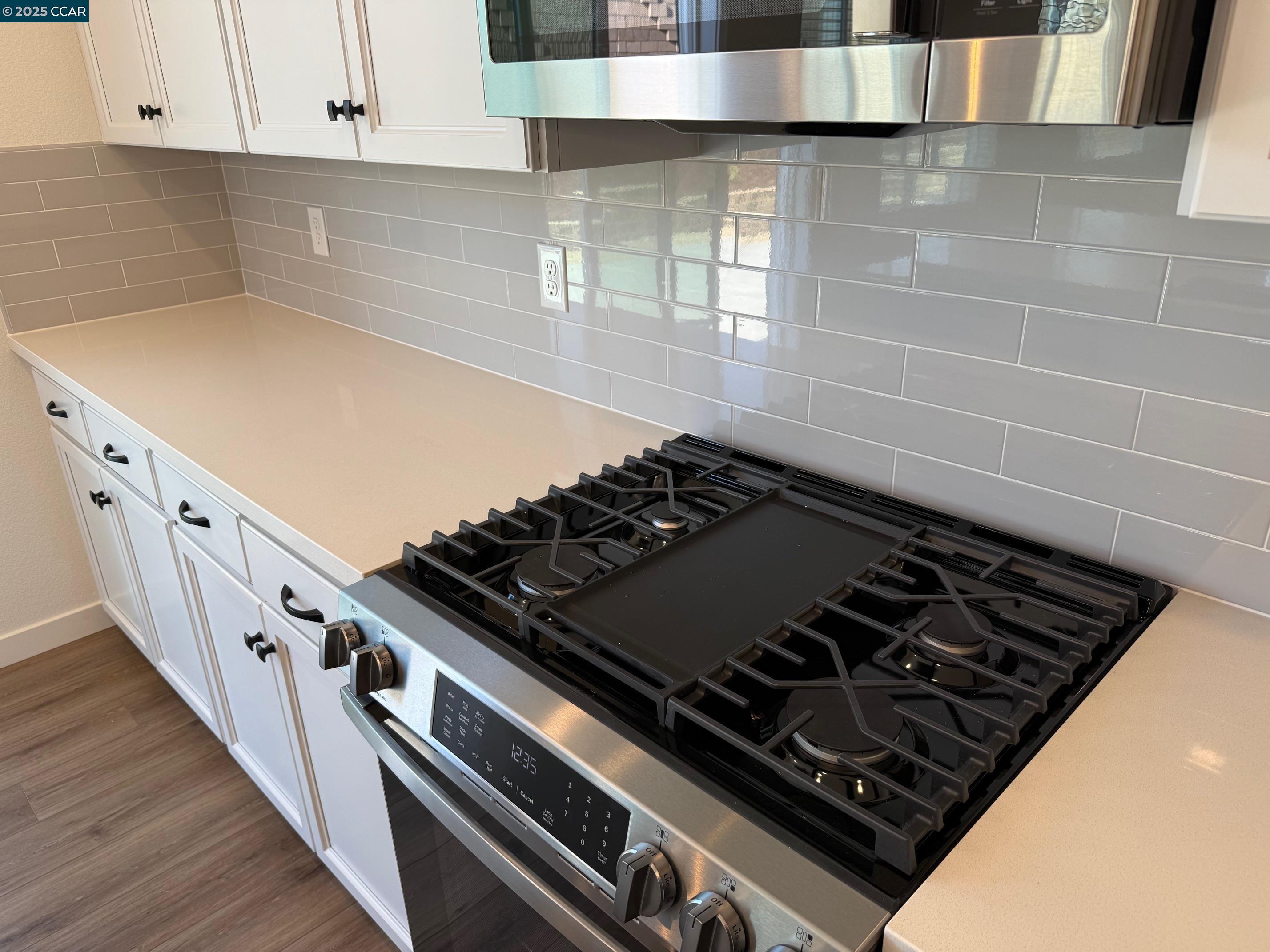 4786 Cantrell Drive Folsom, CA 95630 - Photo 12 of 30 a close view of a stove top oven sitting inside of a kitchen