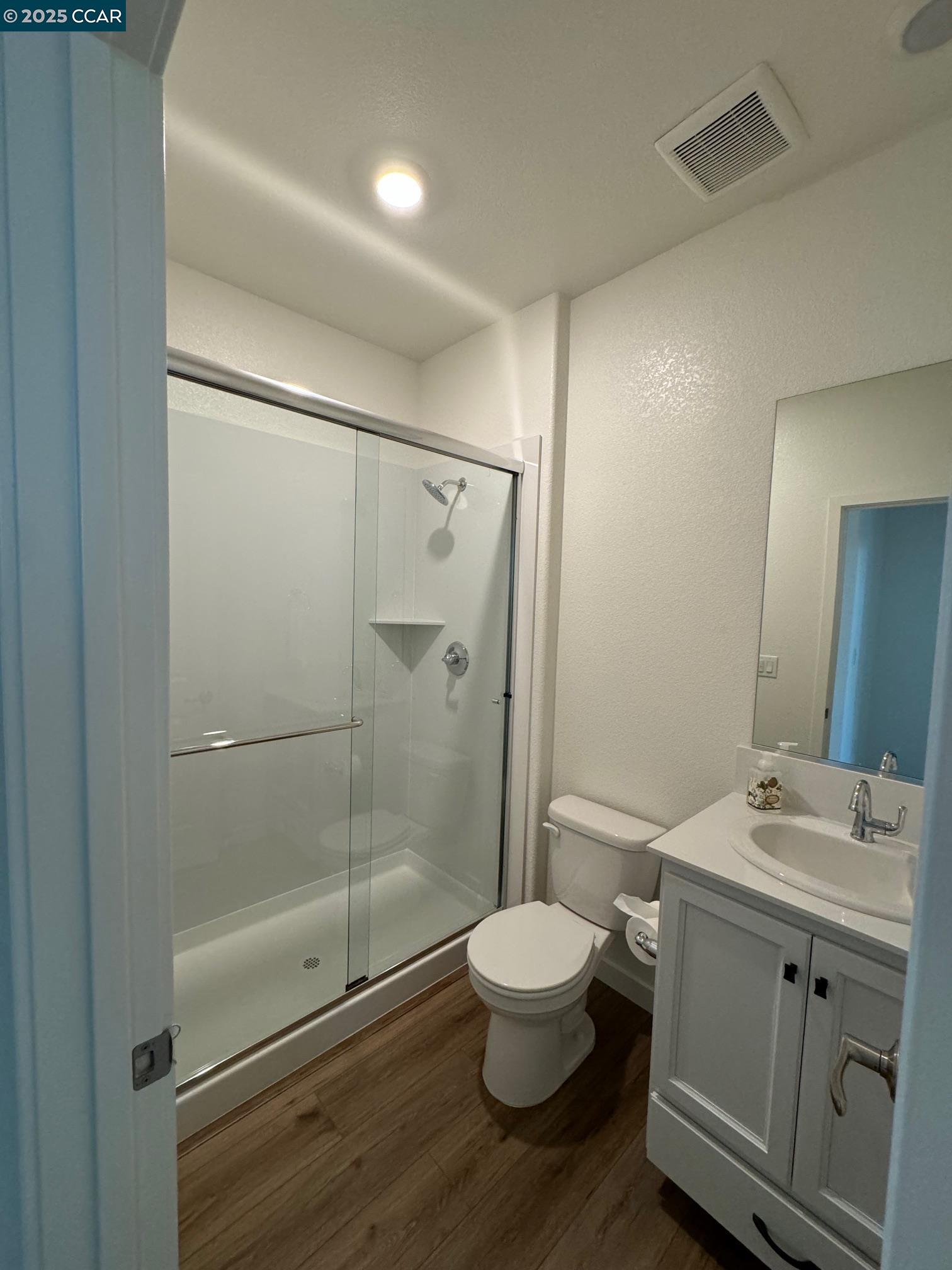 4786 Cantrell Drive Folsom, CA 95630 - Photo 17 of 30 a bathroom with a double vanity sink toilet and shower