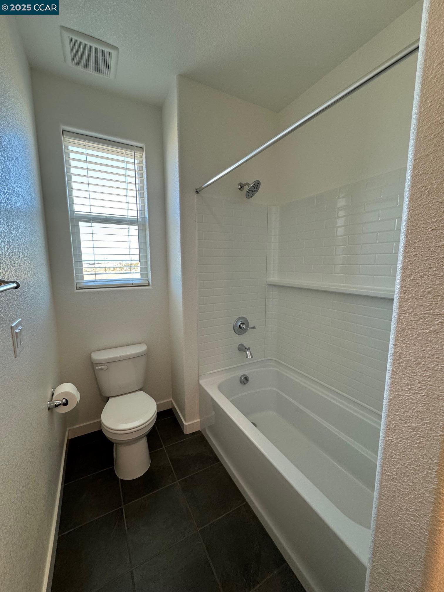 4786 Cantrell Drive Folsom, CA 95630 - Photo 25 of 30 a bathroom with a toilet sink and bathtub