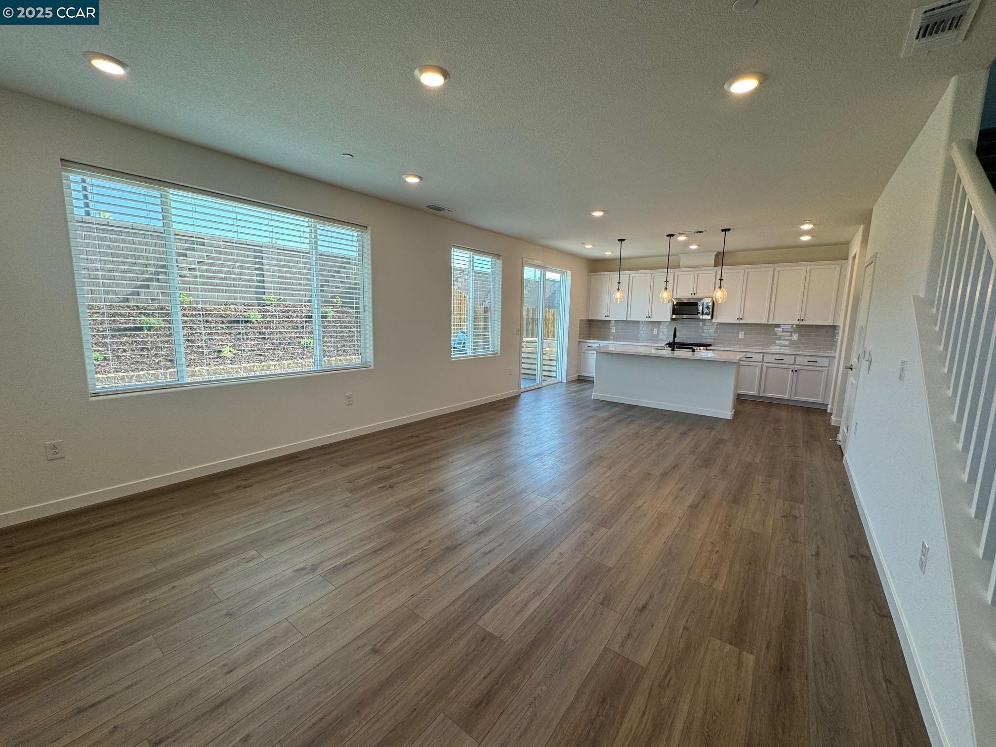 4786 Cantrell Drive Folsom, CA 95630 - Photo 6 of 30 a view of kitchen with kitchen island wooden floor window and stainless steel appliances