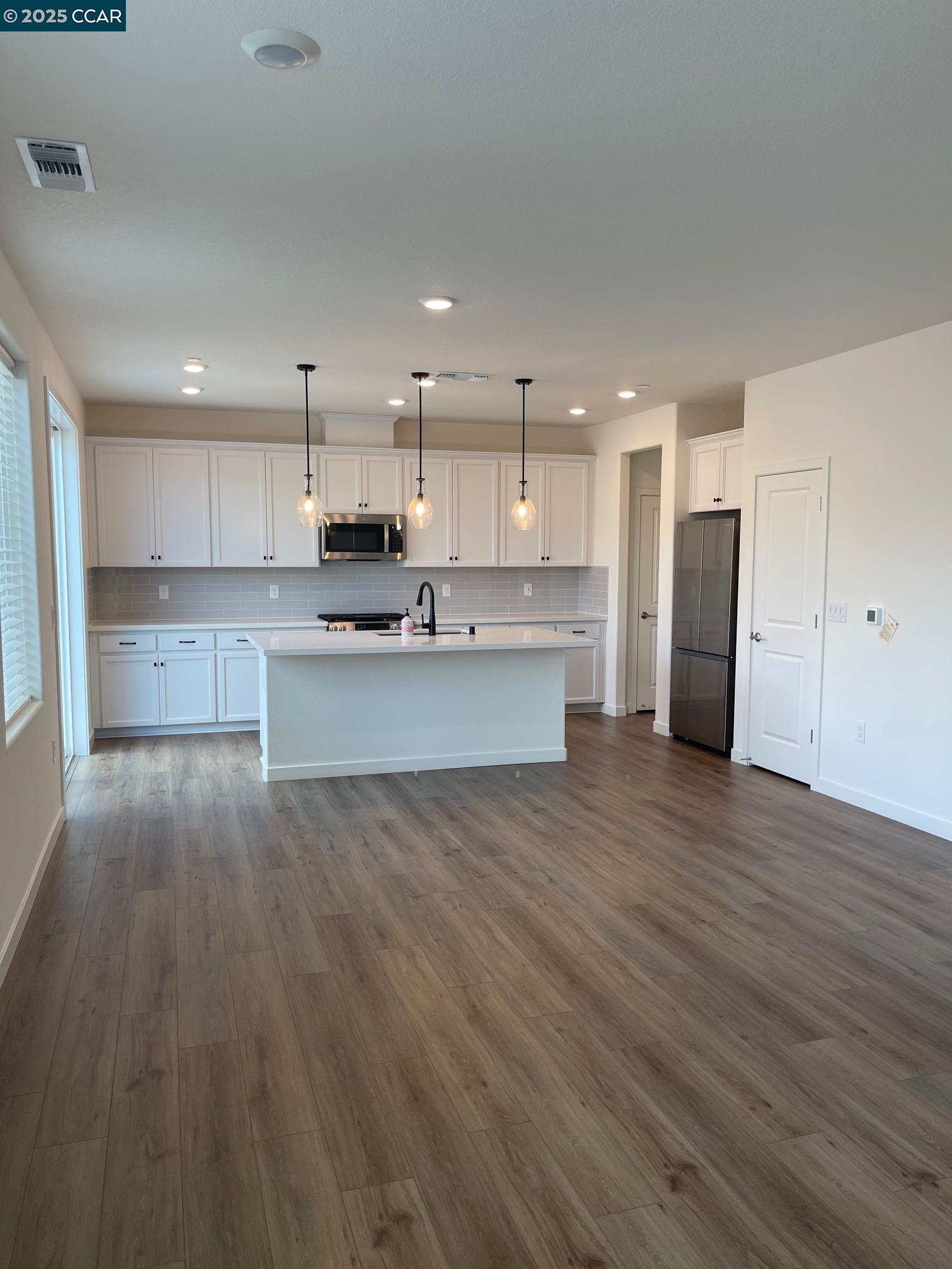 4786 Cantrell Drive Folsom, CA 95630 - Photo 8 of 30 a view of kitchen with wooden floor