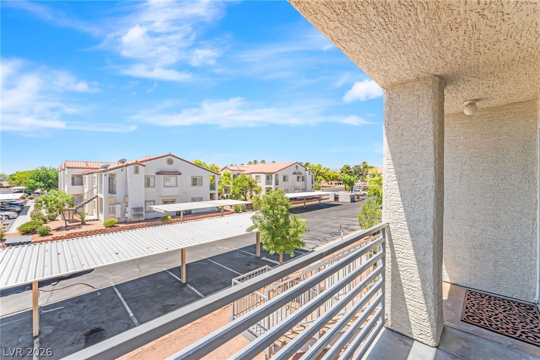 3318 North Decatur Boulevard, Unit 2152 Las Vegas, NV 89130 - Photo 5 of 58 A top-level balcony offers commanding views of the community and convenient covered parking.