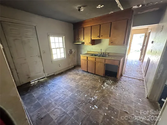 a view of an empty room and window