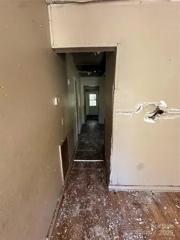 a view of a kitchen with sink dishwasher and wooden floor