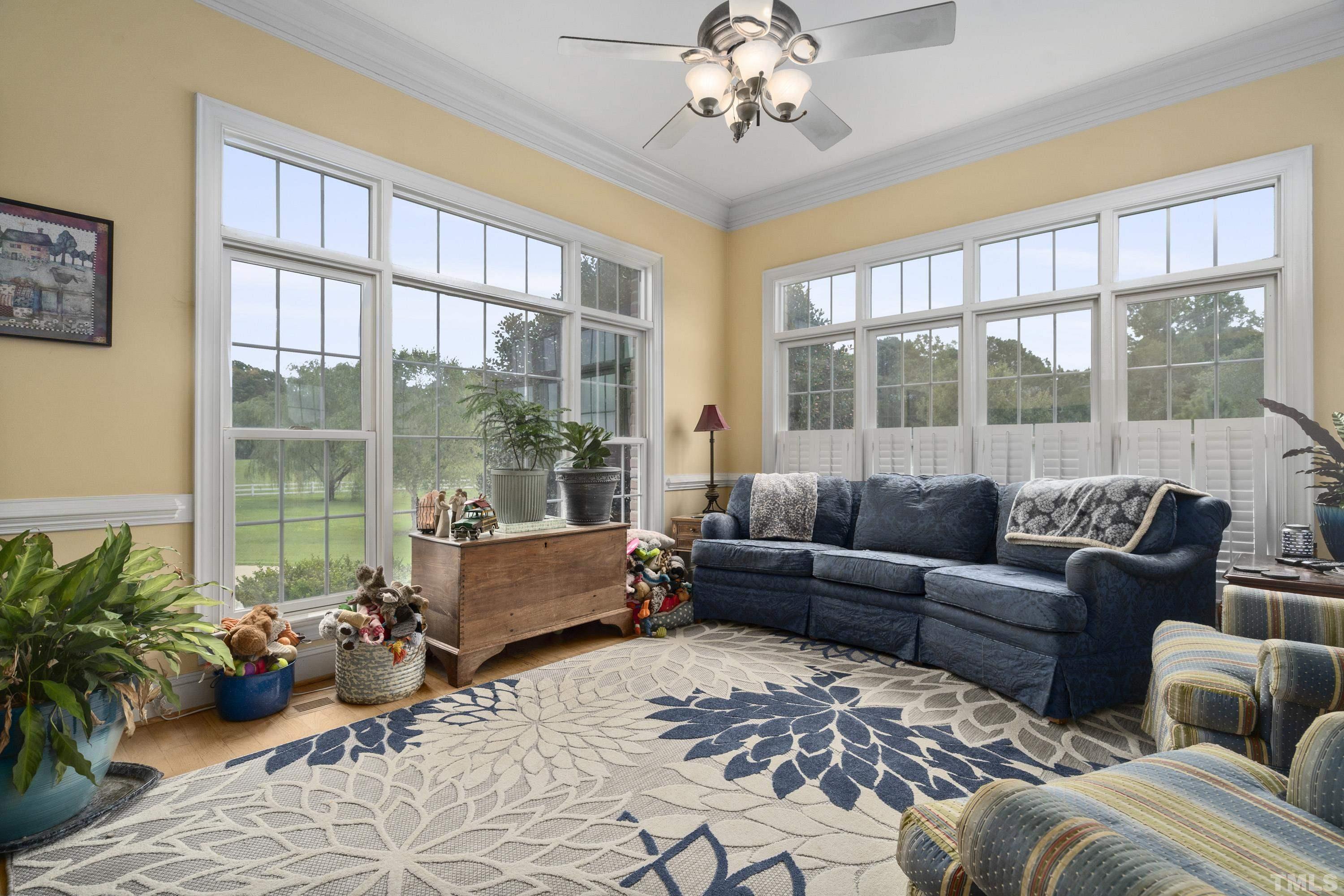 1016 Moss Road Zebulon, NC 27597 - Photo 13 of 30 a living room with furniture and a large window