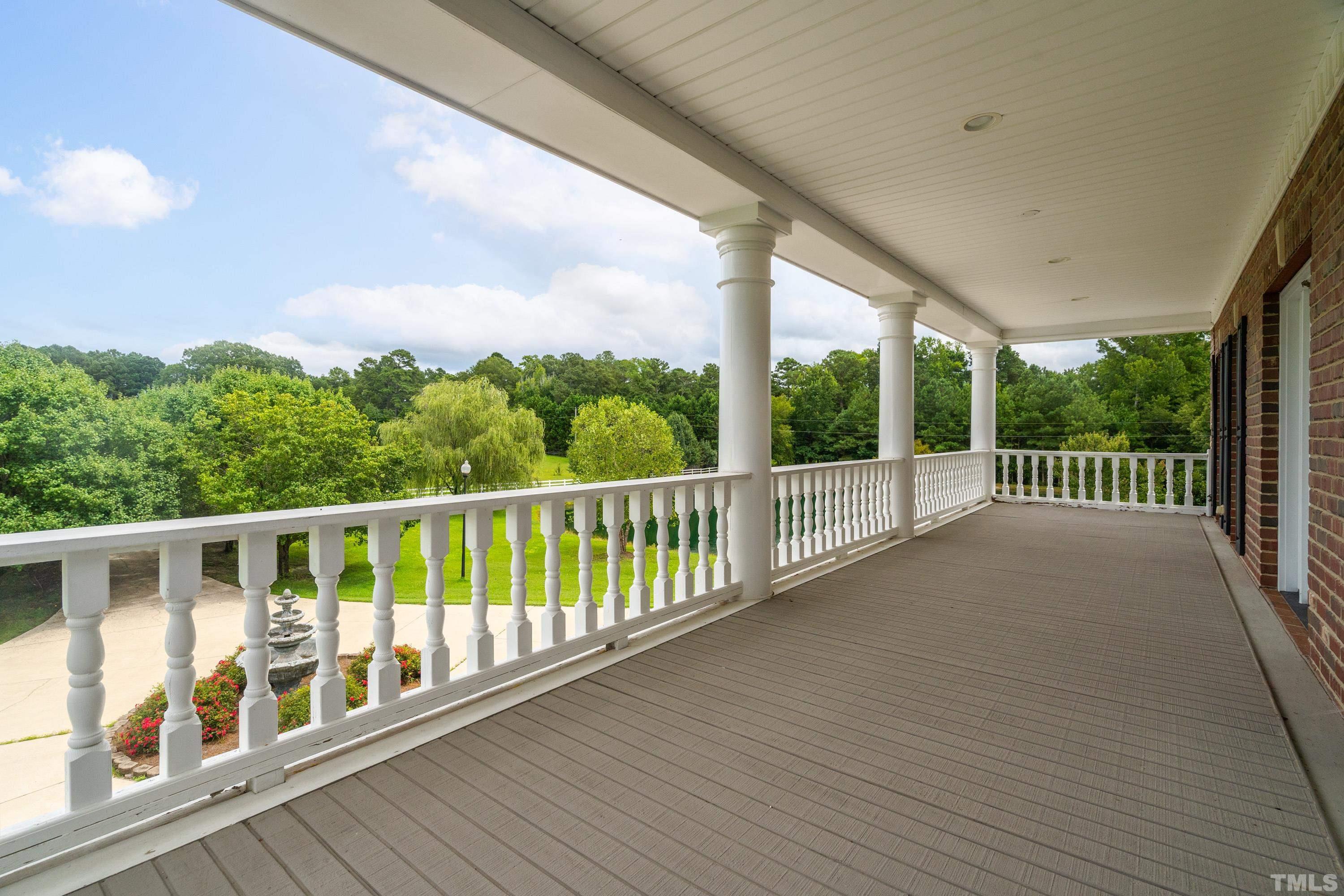 1016 Moss Road Zebulon, NC 27597 - Photo 15 of 30 a view of a balcony with wooden floor