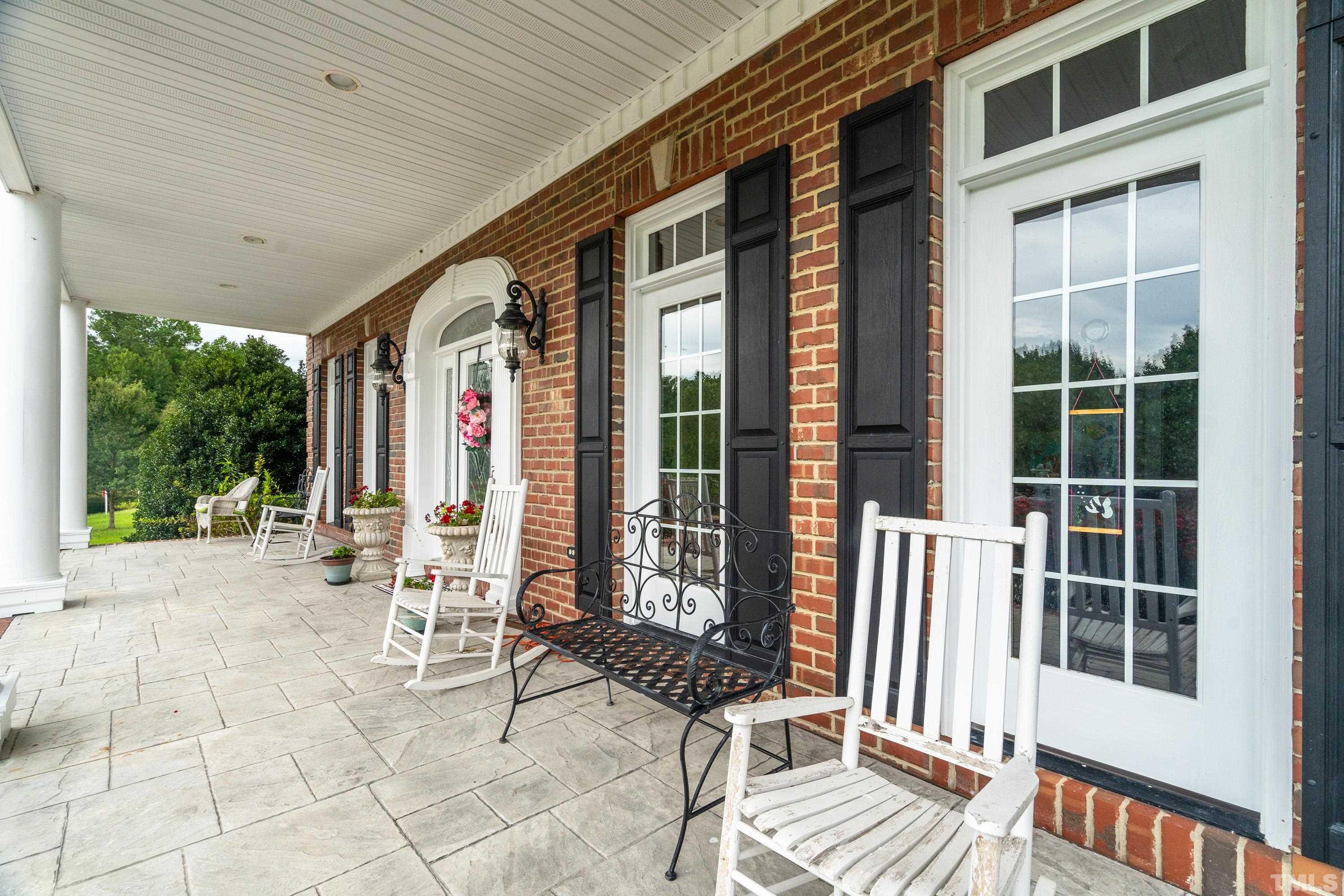 1016 Moss Road Zebulon, NC 27597 - Photo 17 of 30 a building outdoor space with seating space and garden