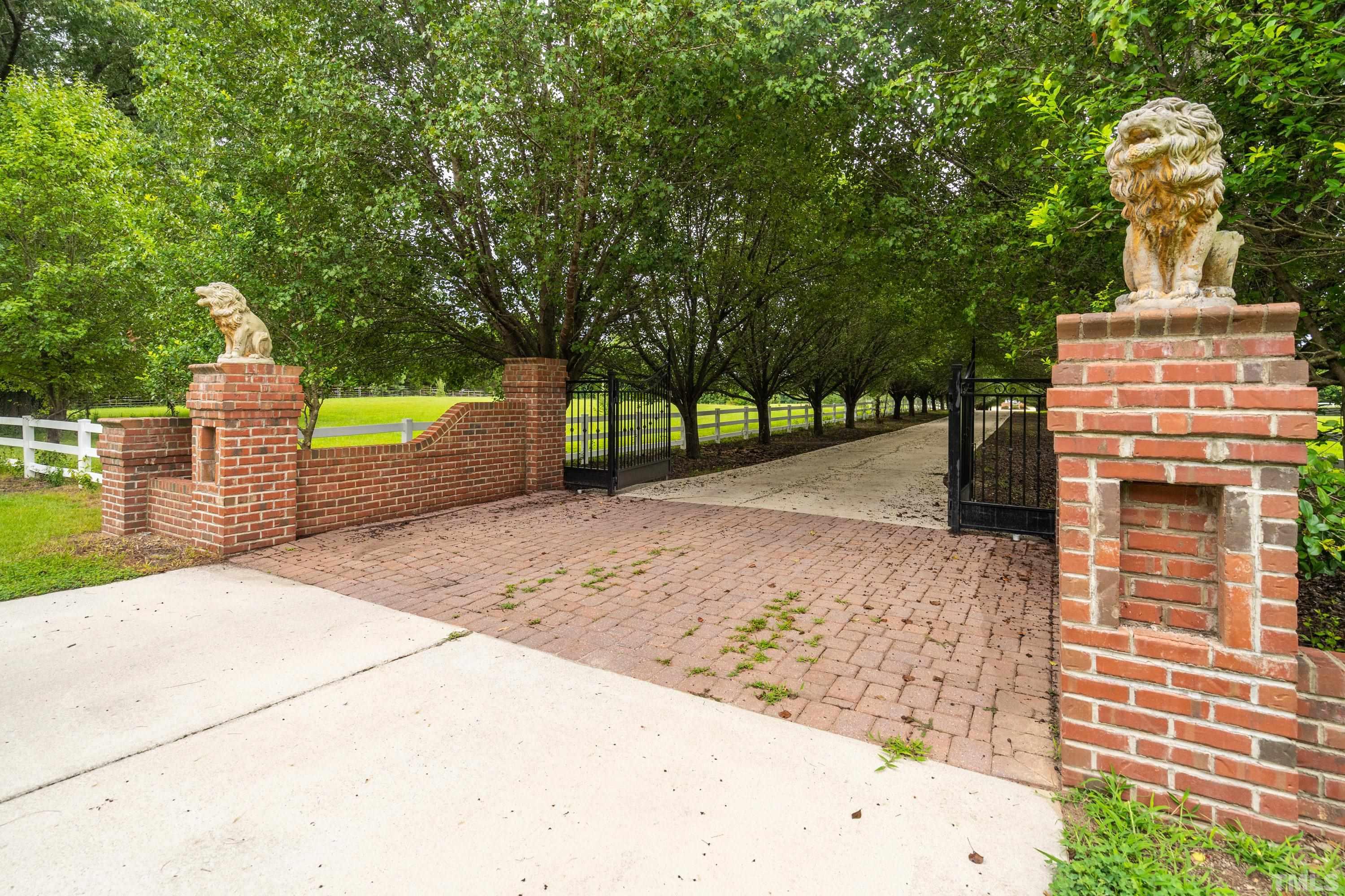 1016 Moss Road Zebulon, NC 27597 - Photo 26 of 30 a front view of a house with a yard