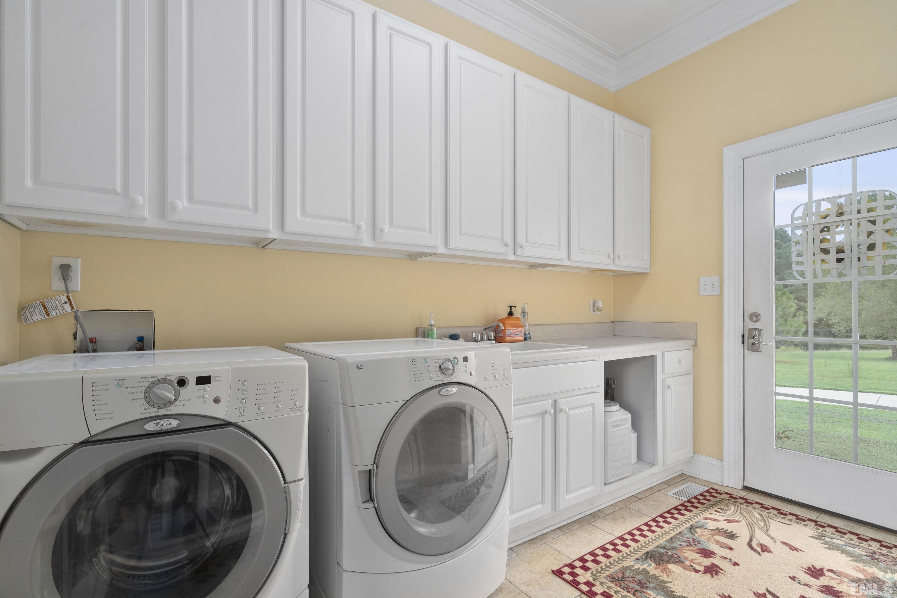 1016 Moss Road Zebulon, NC 27597 - Photo 28 of 30 a utility room with dryer and washer