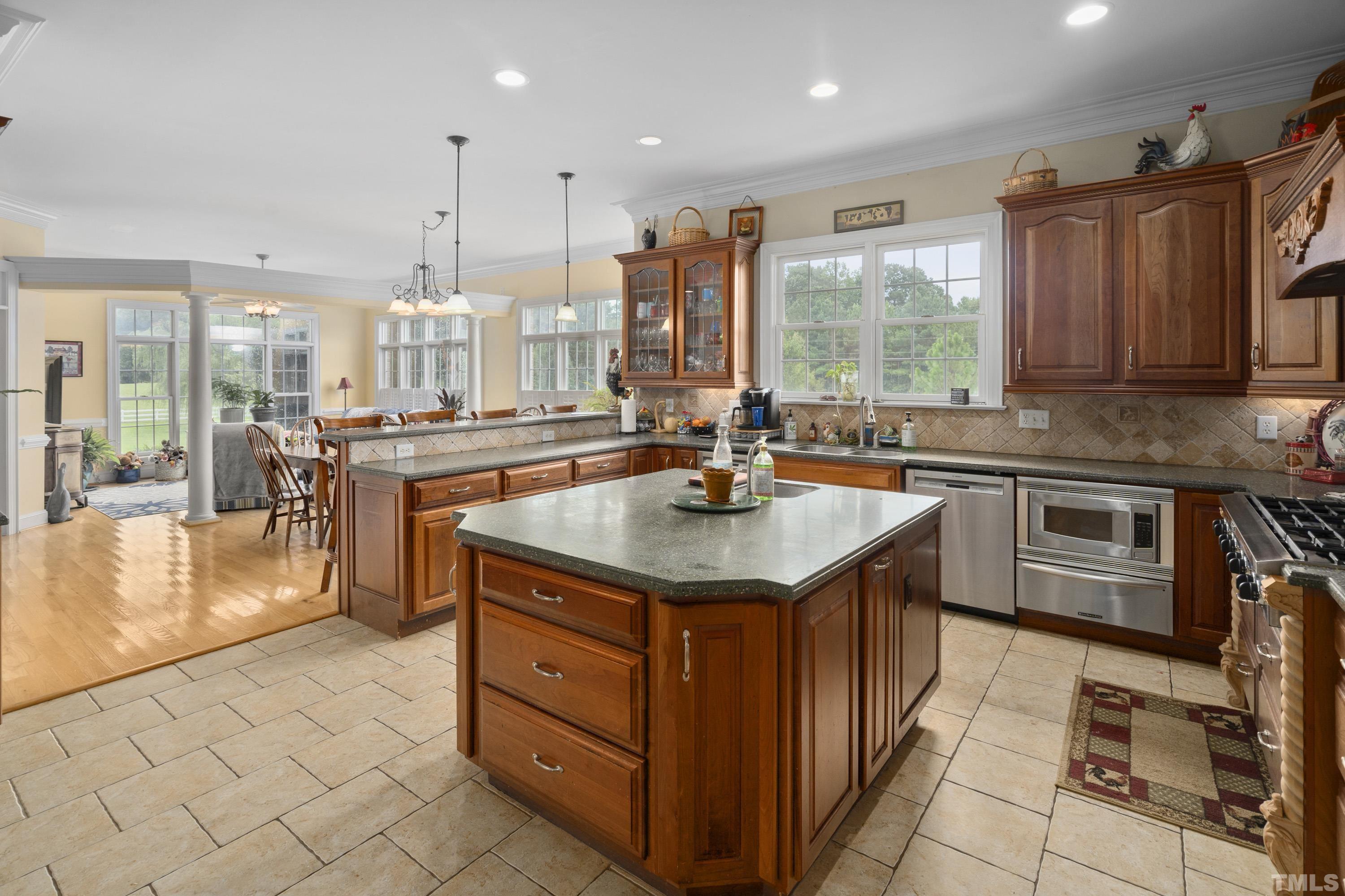 1016 Moss Road Zebulon, NC 27597 - Photo 8 of 30 a kitchen with a sink stove and cabinets