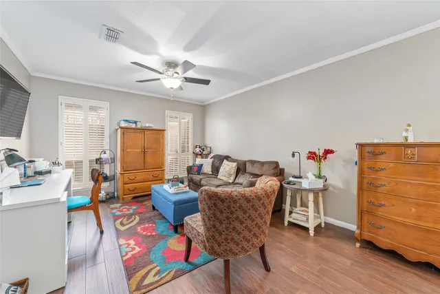 a bathroom with a granite countertop sink mirror vanity and bathtub
