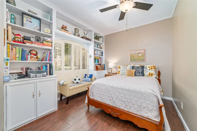 a bathroom with a granite countertop toilet sink and mirror