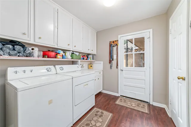 a view of house with garden space and trees