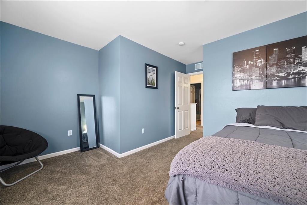204 Pleasant Ridge Road McKees Rocks, PA 15136 - Photo 15 of 23 a bedroom with a bed and painting on the wall
