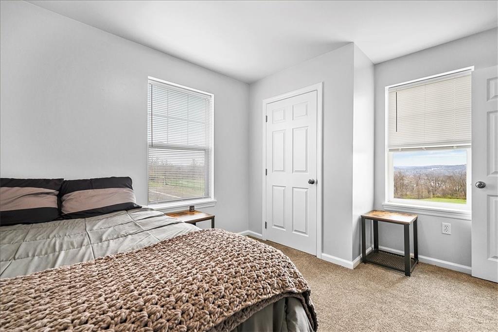 204 Pleasant Ridge Road McKees Rocks, PA 15136 - Photo 16 of 23 a bedroom with a bed and a window