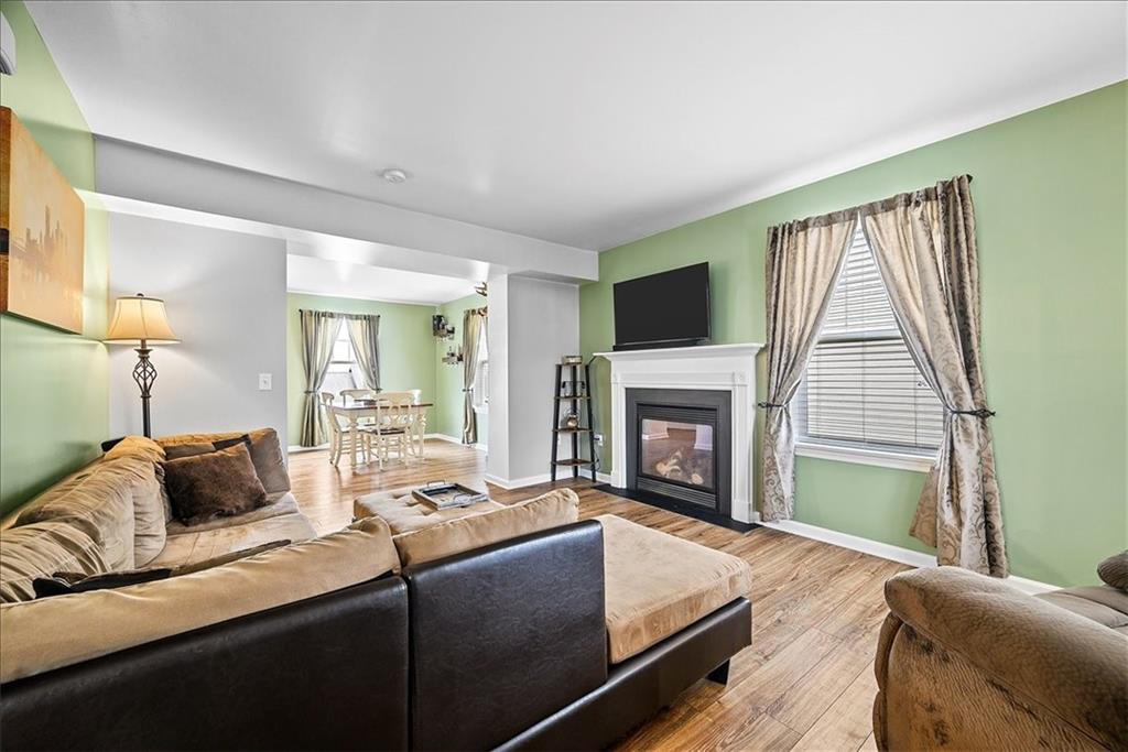204 Pleasant Ridge Road McKees Rocks, PA 15136 - Photo 6 of 23 a living room with furniture and a fireplace