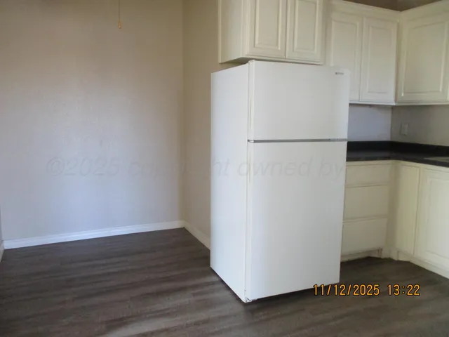 a white refrigerator freezer sitting in a kitchen