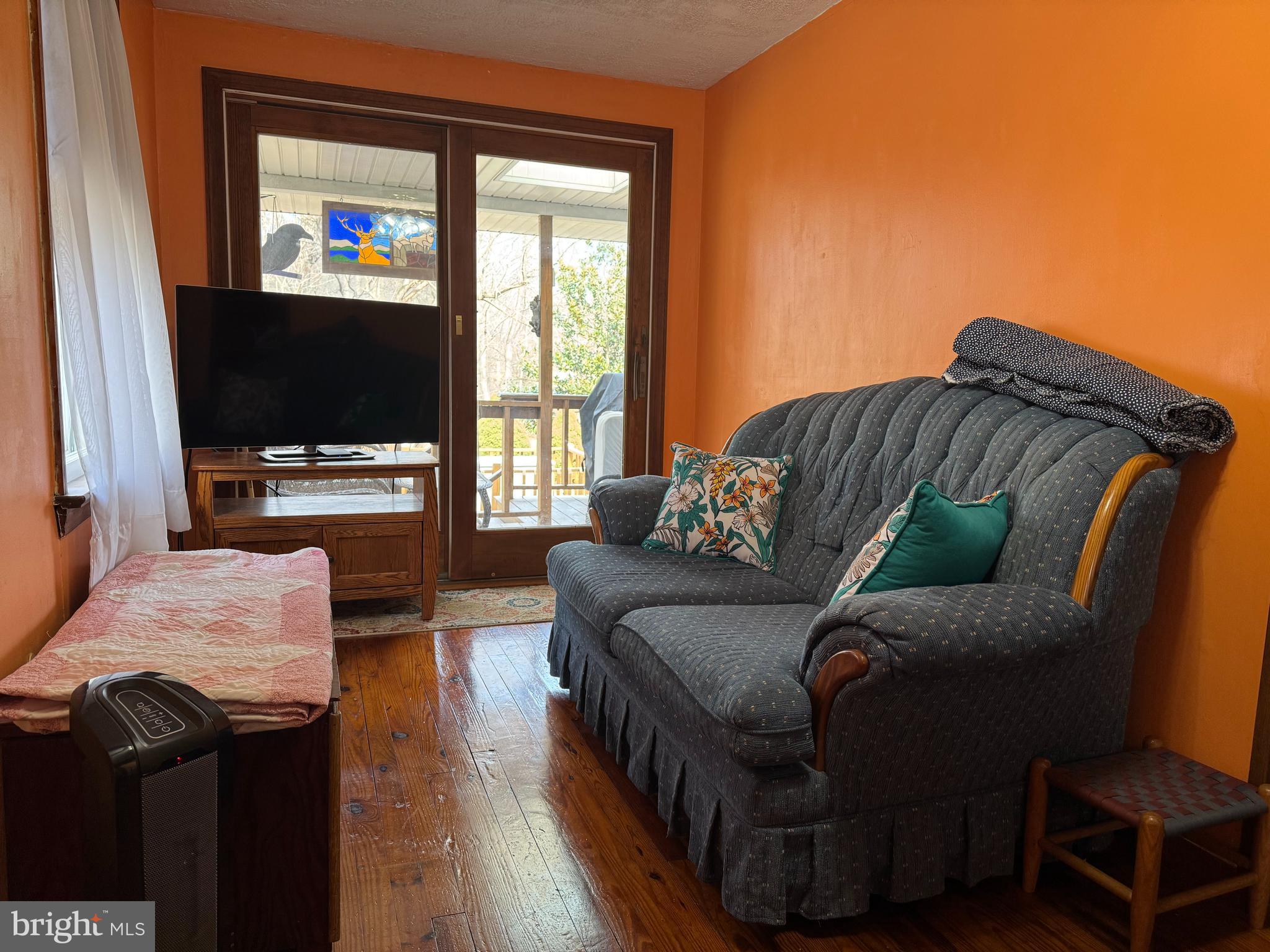 631 McCauley Road Conowingo, MD 21918 - Photo 14 of 32 a living room with furniture and a flat screen tv