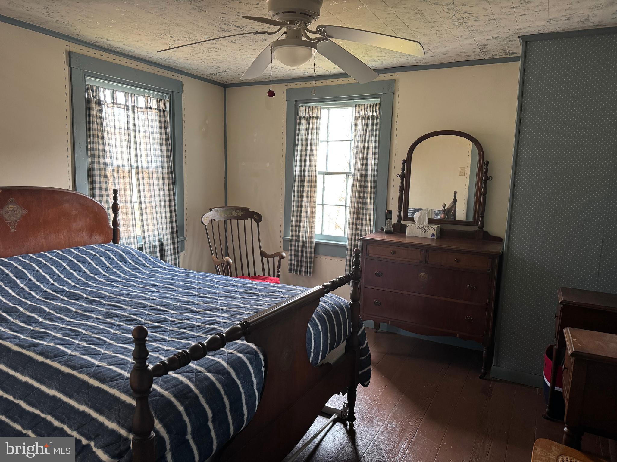 631 McCauley Road Conowingo, MD 21918 - Photo 19 of 32 a bedroom with a bed and a table