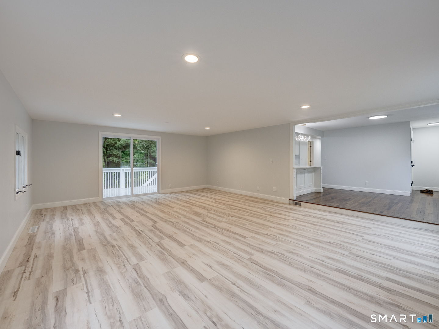 11 Cheshire Road Prospect, CT 06712 - Photo 9 of 38 a view of an empty room with wooden floor and a window