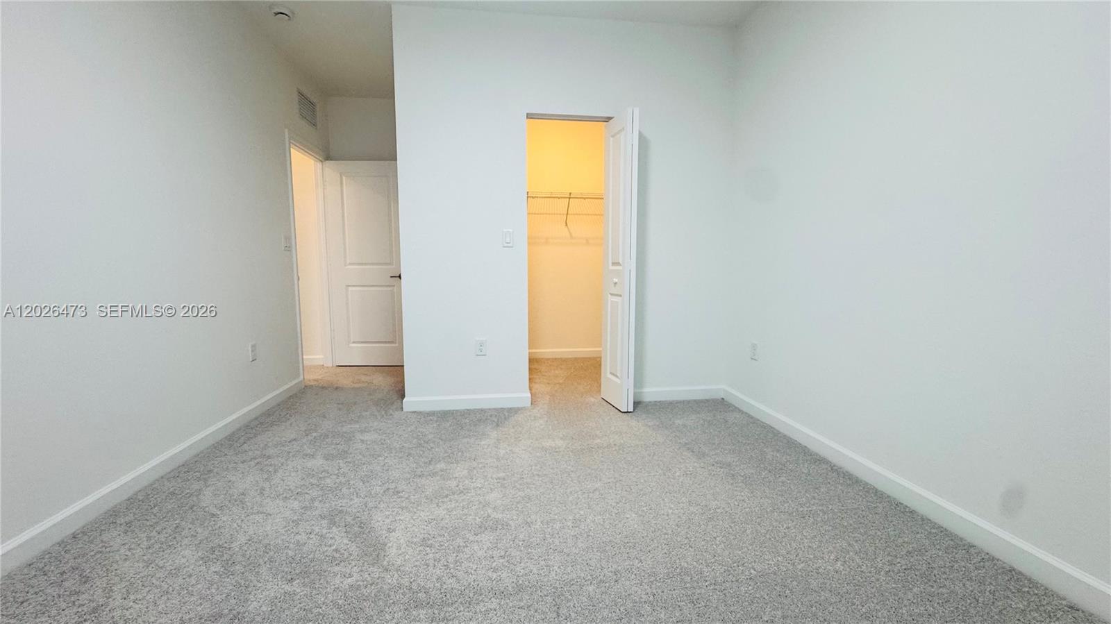19479 Southwest 340th Street, Unit 1 Homestead, FL 33034 - Photo 21 of 58 a view of an empty room with a window