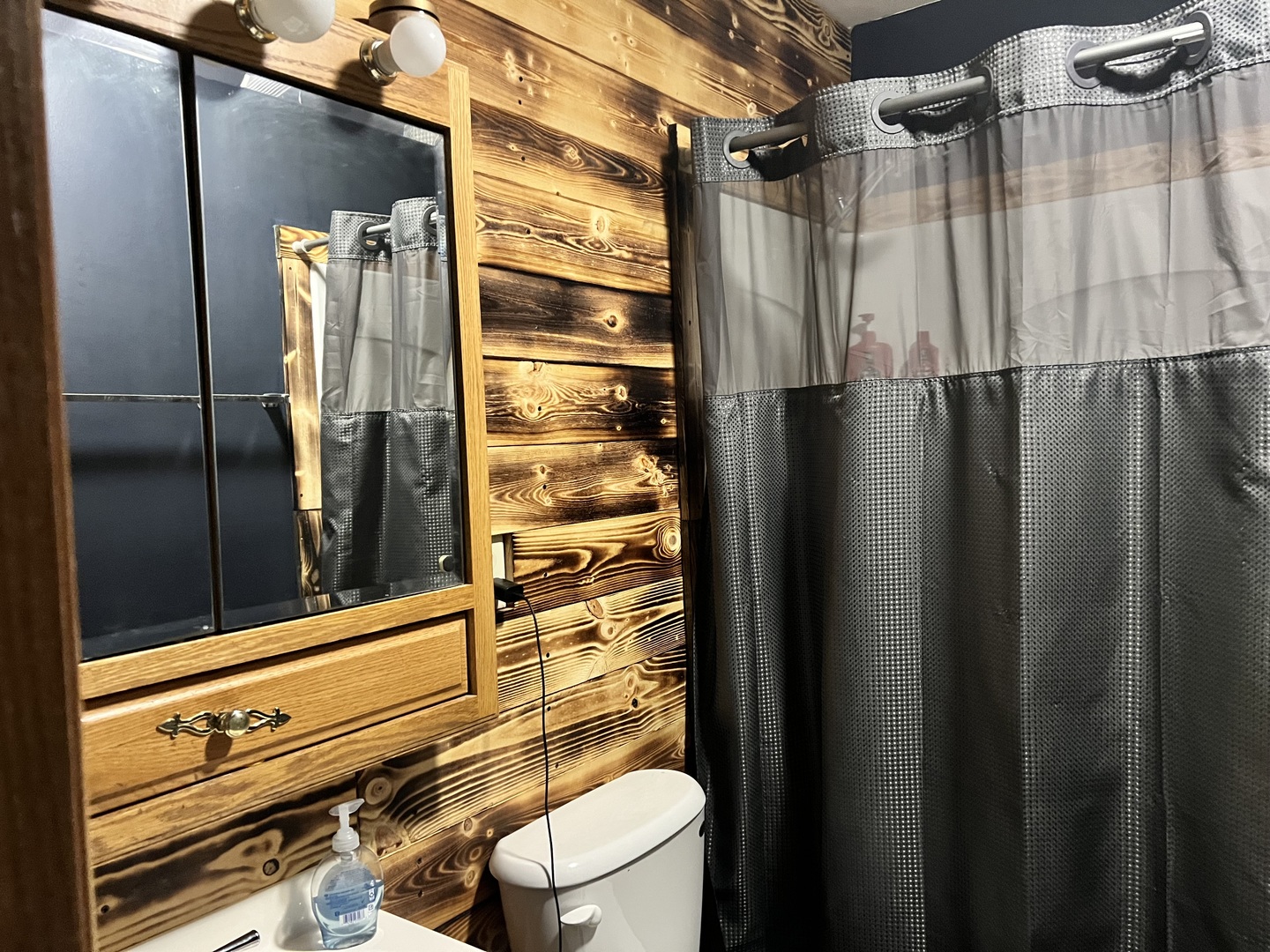 841 South High Street Paxton, IL 60957 - Photo 6 of 6 a bathroom with a shower and a mirror