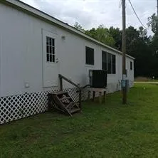 a view of a house with backyard