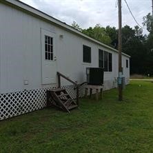 95 Pine Ridge Drive Cleveland, TX 77327 - Photo 19 of 37 a view of a house with backyard