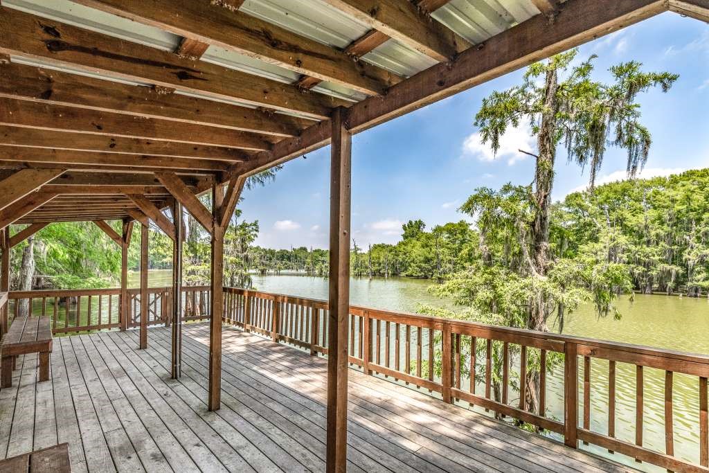 95 Pine Ridge Drive Cleveland, TX 77327 - Photo 33 of 37 a view of a balcony with wooden floor