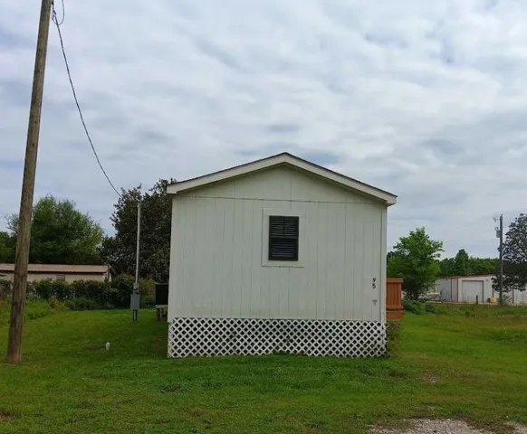 a house view with a backyard space
