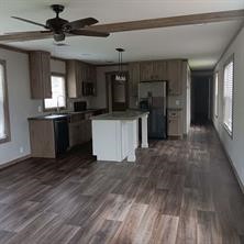 95 Pine Ridge Drive Cleveland, TX 77327 - Photo 10 of 37 a kitchen with stainless steel appliances granite countertop a refrigerator a sink and a stove