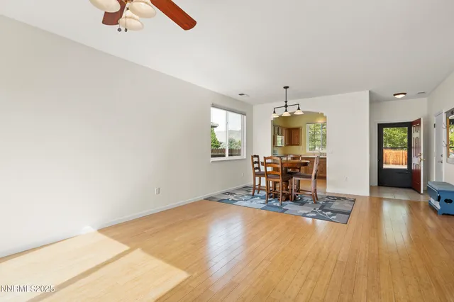 a dining room with furniture and entryway