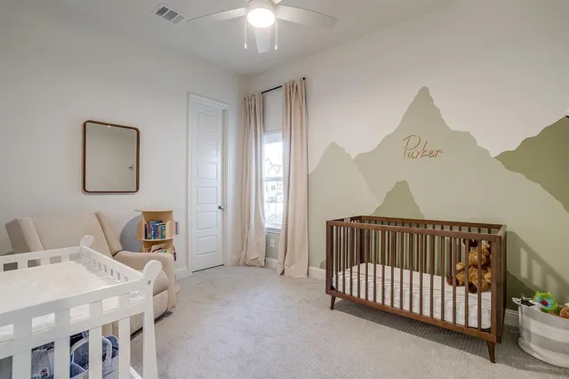 a bedroom with furniture and a window