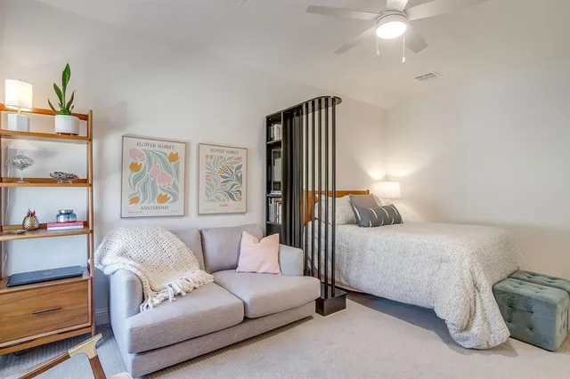 a bedroom with a bed and a couch