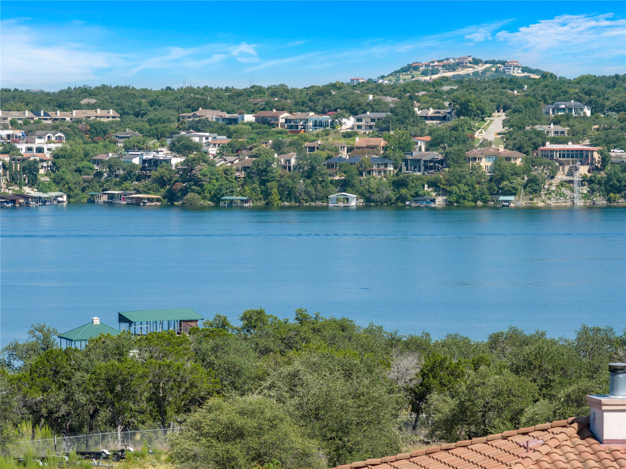330 Southwind Road Point Venture, TX 78645 - Photo 18 of 40 Panoramic views of the main body of Lake Travis from the kitchen/dining, living room, primary bedroom, and back deck!