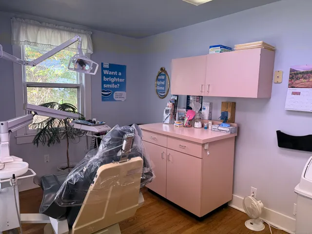 a room with furniture a flat screen tv and a window