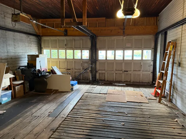 a room with wooden floor and furniture