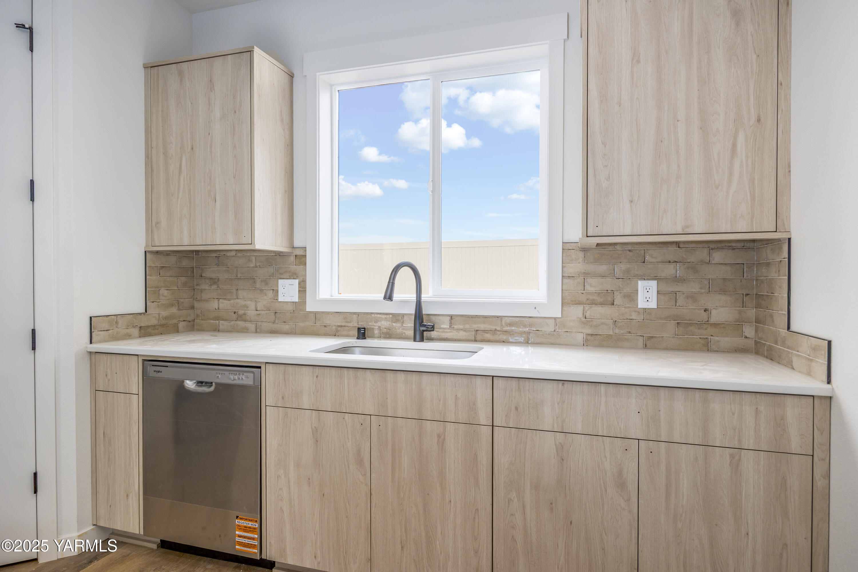 215 Shrute Road Prosser, WA 99350 - Photo 13 of 27 a kitchen with a sink and cabinets
