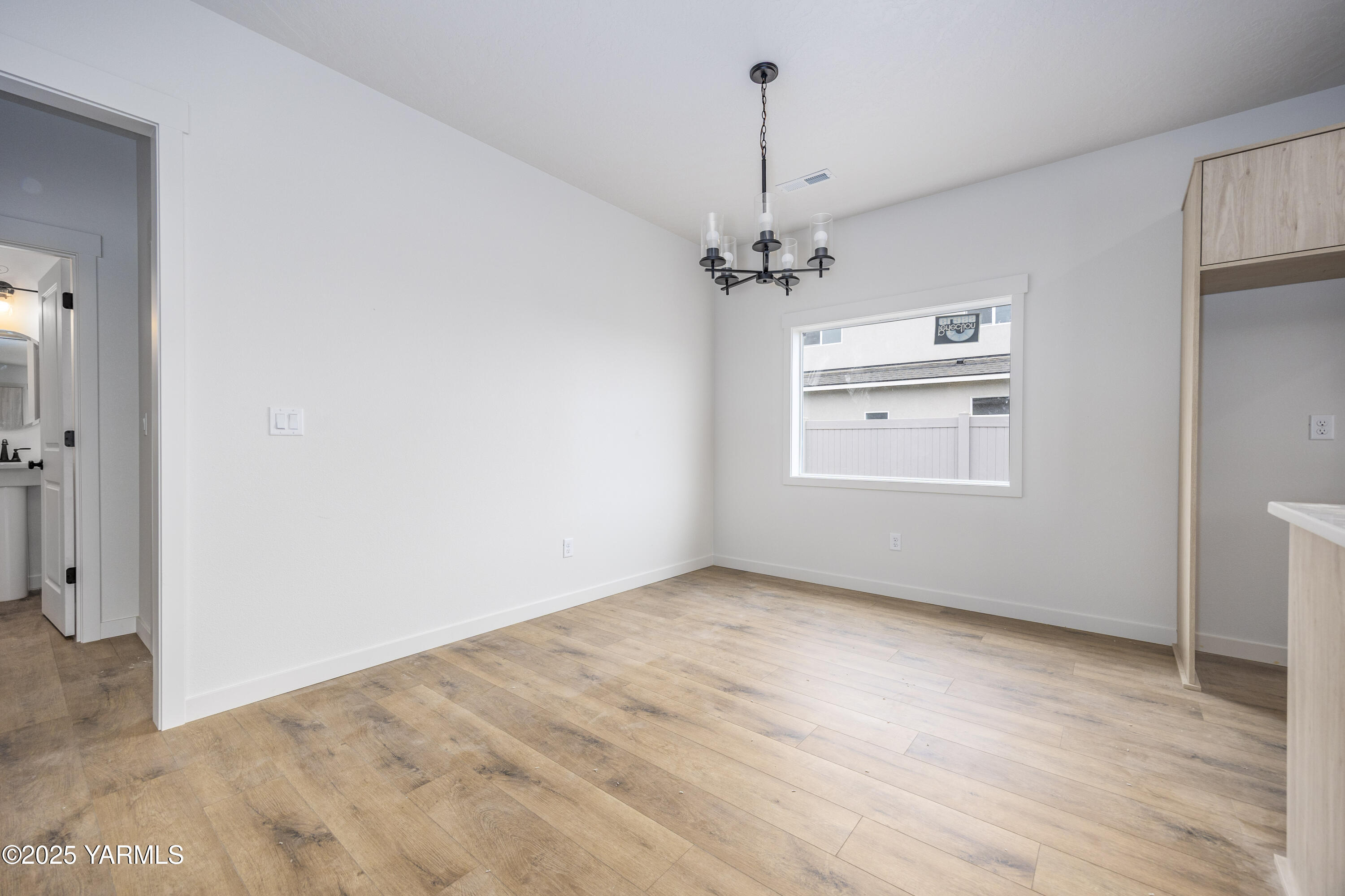 215 Shrute Road Prosser, WA 99350 - Photo 6 of 27 a view of an empty room with a window