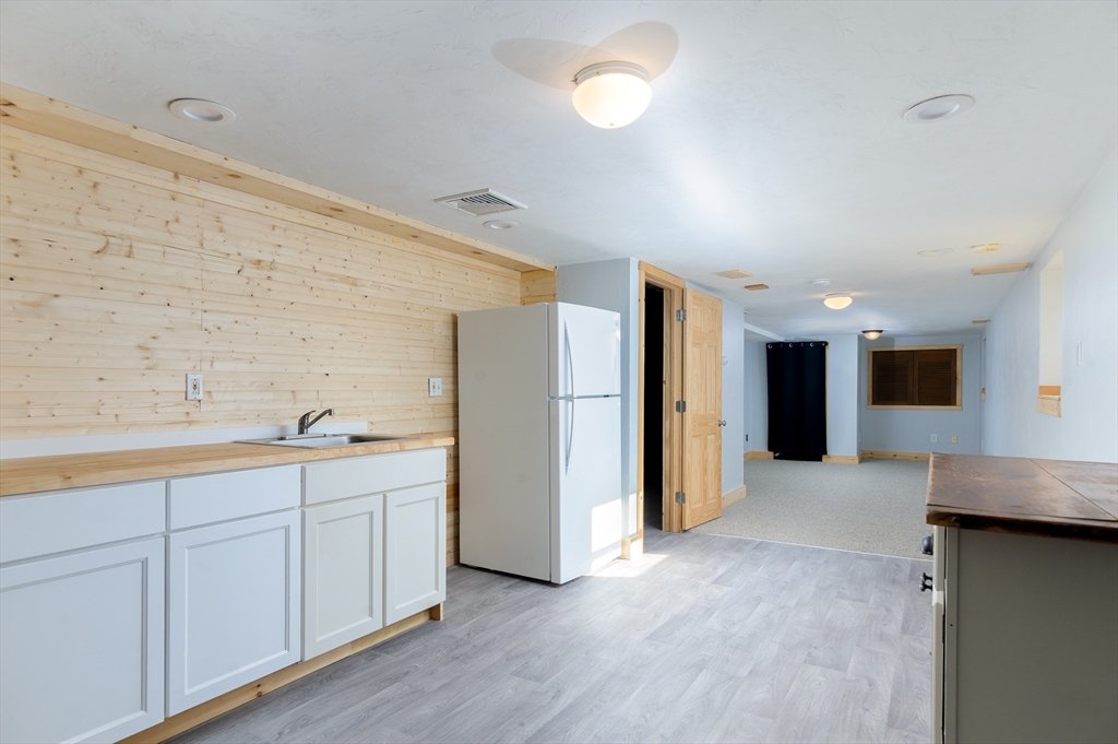 280 South Barre Road Barre, MA 01005 - Photo 17 of 25 a view of a kitchen with a sink and a refrigerator