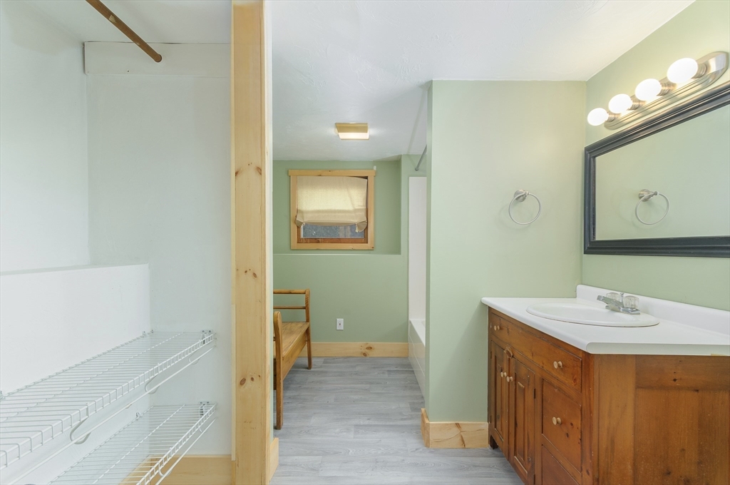 280 South Barre Road Barre, MA 01005 - Photo 22 of 25 a bathroom with a sink a mirror and a shower