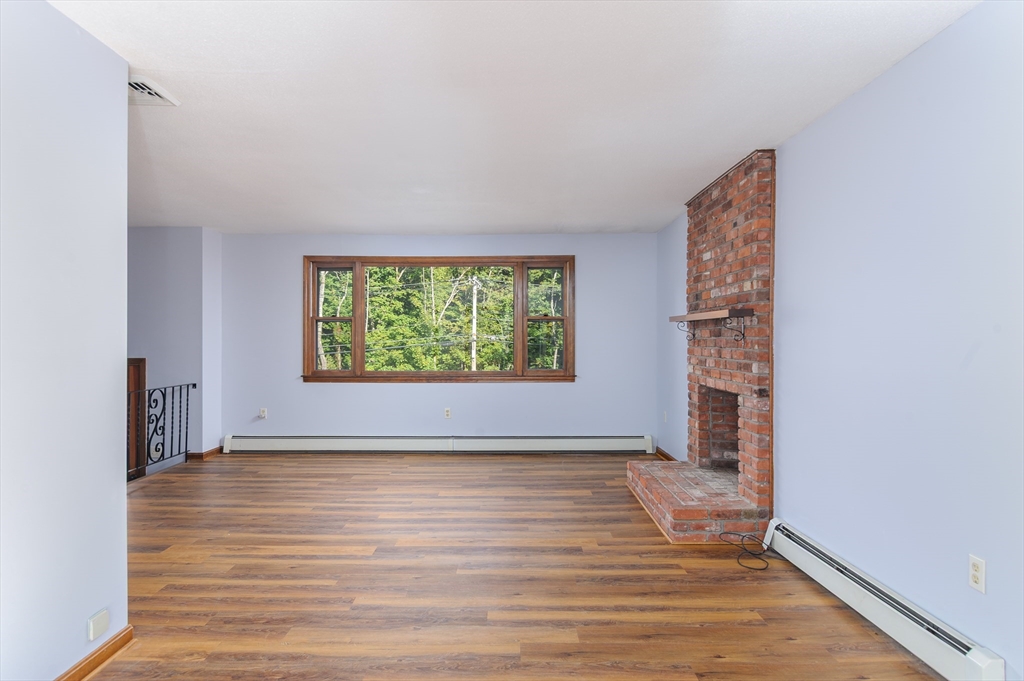 280 South Barre Road Barre, MA 01005 - Photo 6 of 25 wooden floor in an empty room with a window