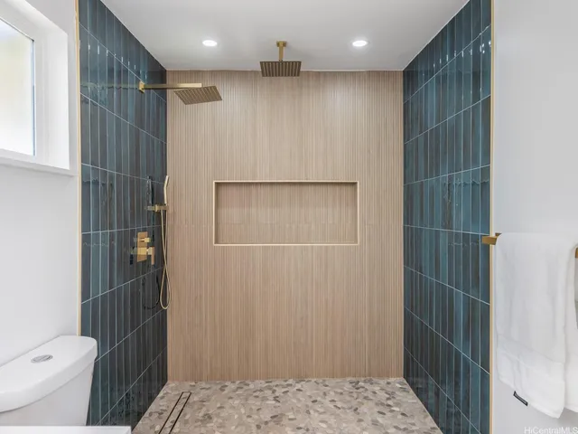 a bathroom with a shower and a toilet