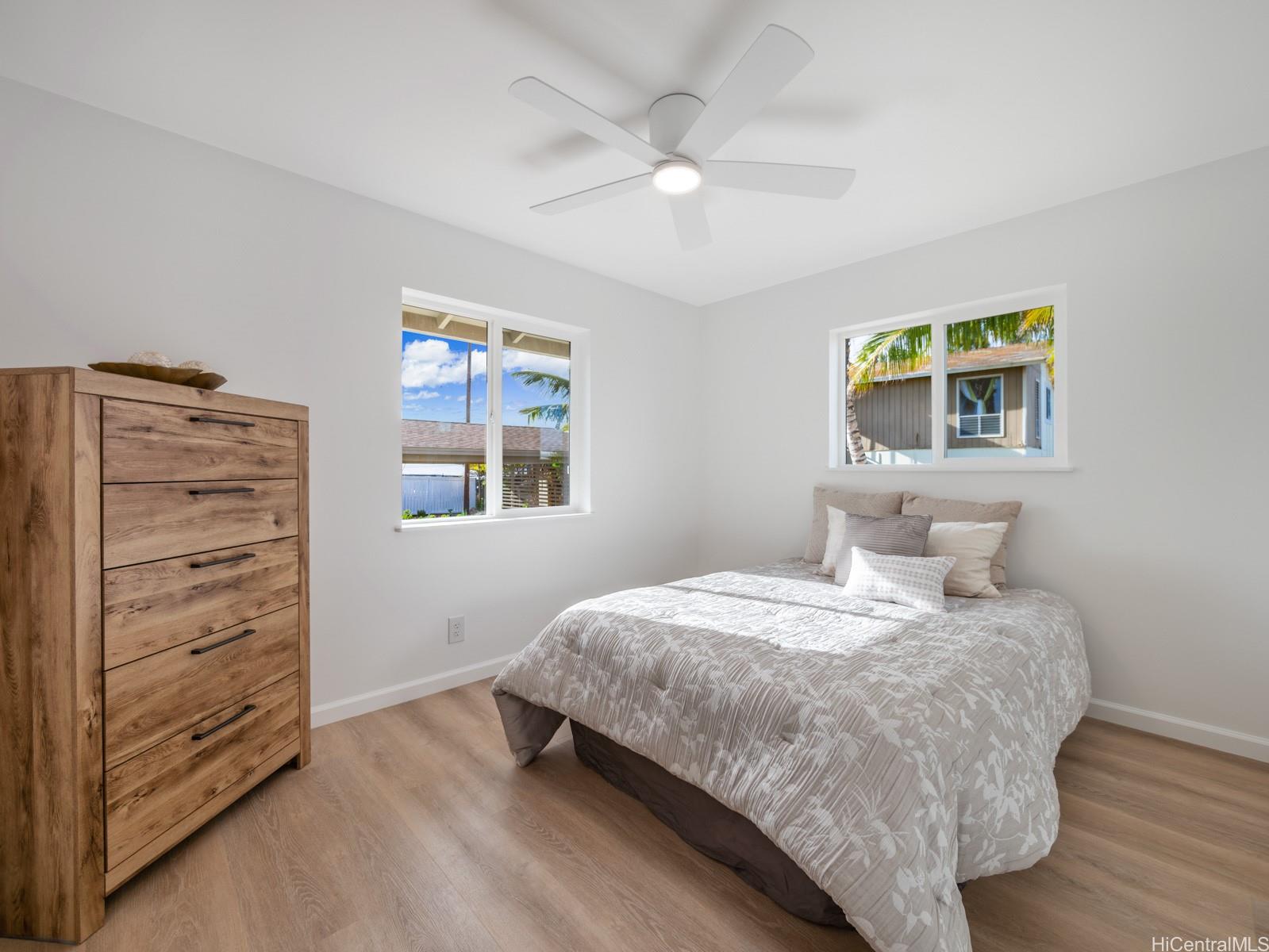 91-481 Ewa Beach Road, Unit C Ewa Beach, HI 96706 - Photo 18 of 25 a bedroom with a bed and a window