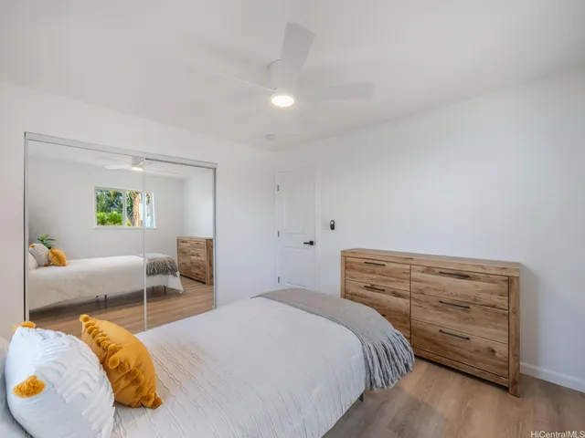 a bedroom with a bed and a couch