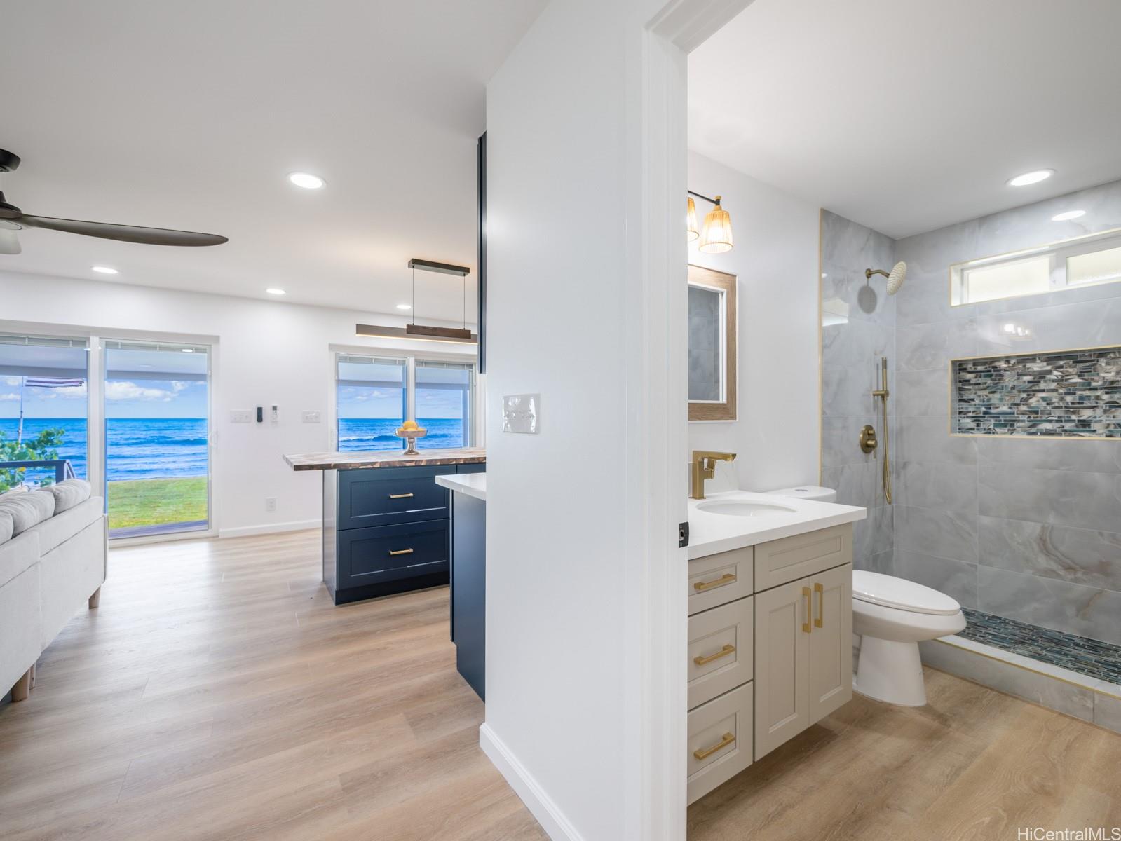91-481 Ewa Beach Road, Unit C Ewa Beach, HI 96706 - Photo 20 of 25 a bathroom with a sink a toilet and shower