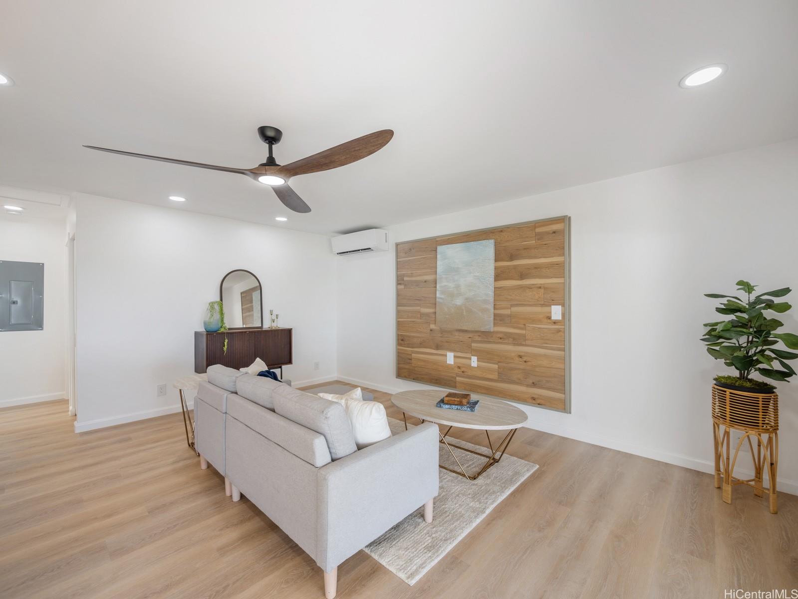 91-481 Ewa Beach Road, Unit C Ewa Beach, HI 96706 - Photo 6 of 25 a living room with furniture and a large window