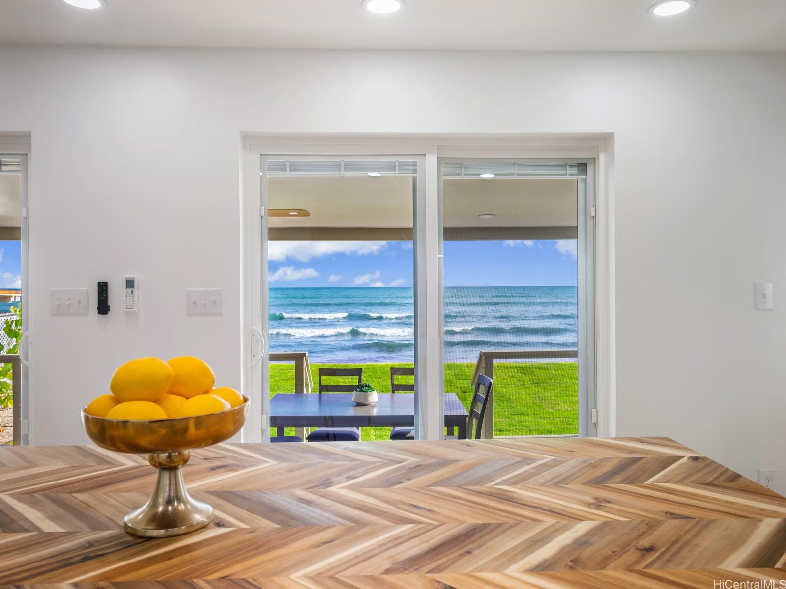 91-481 Ewa Beach Road, Unit C Ewa Beach, HI 96706 - Photo 9 of 25 a view of an empty room with a window and kitchen view