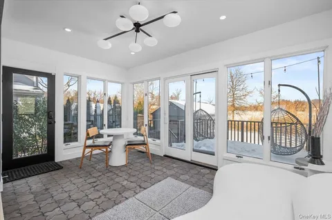 a living room with furniture and windows