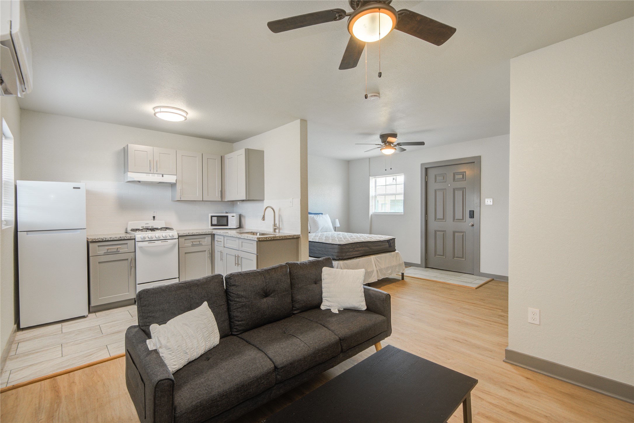 208 West 2nd Street Sweeny, TX 77480 - Photo 5 of 12 a living room with furniture and a view of kitchen